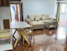 Living room with dining area featuring wooden flooring and modern furniture