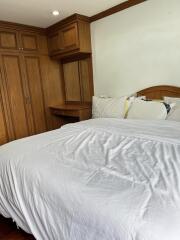 Bedroom with wooden wardrobe and desk