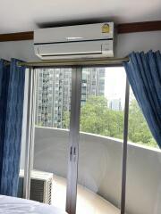 Bedroom with air conditioning and balcony access