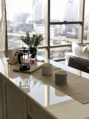 Well-lit kitchen with a city view