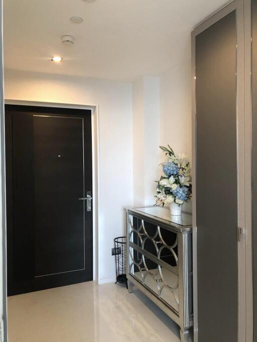 Modern apartment entrance with decorative flowers