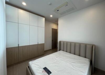 Modern bedroom with bed and wardrobe