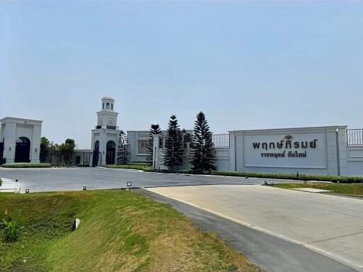 Front view of a residential building with a clock tower