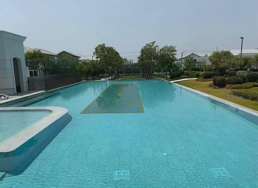 Outdoor swimming pool with landscaped surroundings