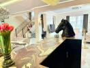 Living room with modern decor including horse head sculpture on the counter.