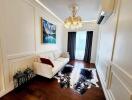 Elegant living room with chandelier and wall art