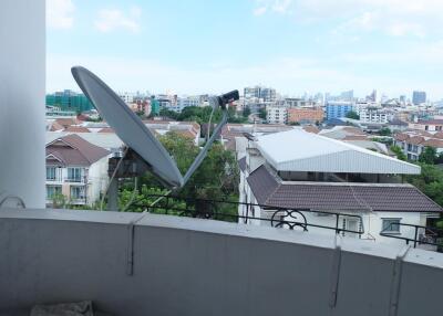 Balcony with city view and satellite dish