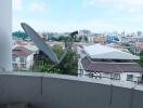 Balcony with city view and satellite dish