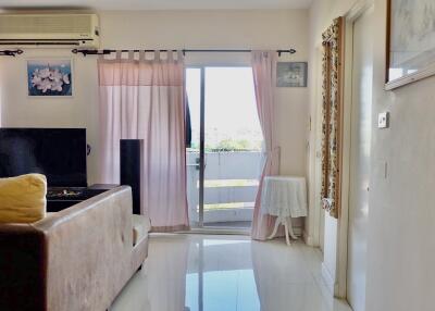 Bright living room with balcony access