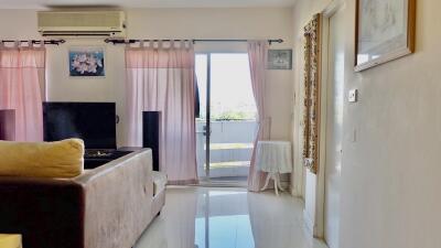 Bright living room with balcony access