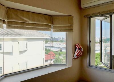 Corner window view in bedroom with air conditioning