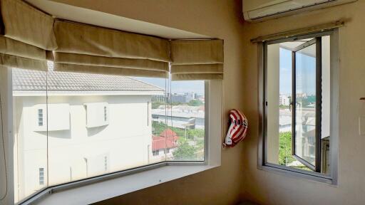 Corner window view in bedroom with air conditioning