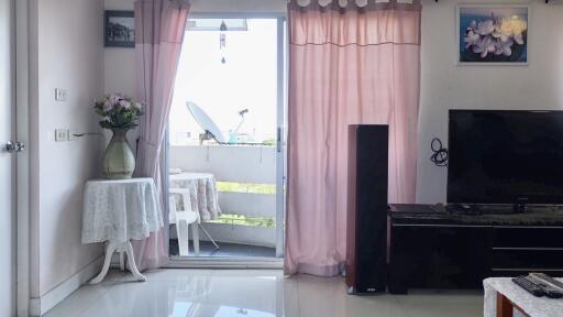 Living room with glass door to balcony