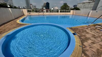 Swimming pool with city skyline view