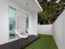 Outdoor patio with sliding glass doors and chairs