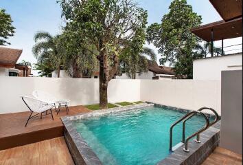 Outdoor pool area with seating