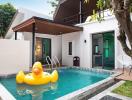 Outdoor area with a swimming pool and inflatable duck float