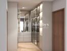 Modern hallway with wooden flooring and mirrored wardrobes