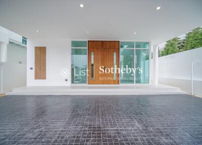 Modern building entrance with glass doors and tiled flooring