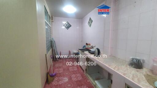 Kitchen with tile countertops and patterned flooring