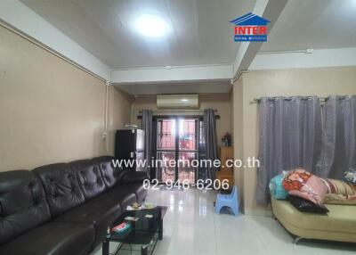 Living room with sofas and AC unit