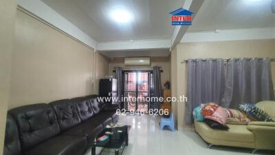 Living room with sofas and AC unit