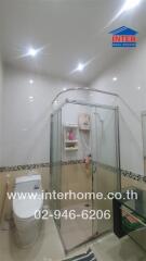 Modern bathroom with glass shower and toilet