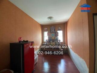 Simple bedroom with shrine and refrigerator