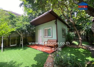 Small house in a lush garden