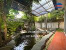 Peaceful backyard with pond and covered patio