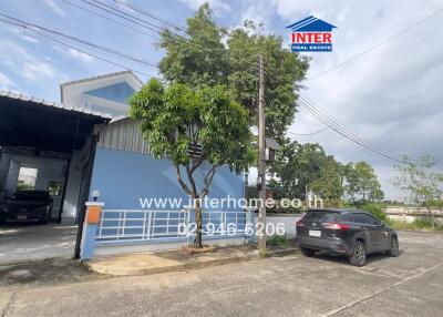 House exterior with driveway and parked cars