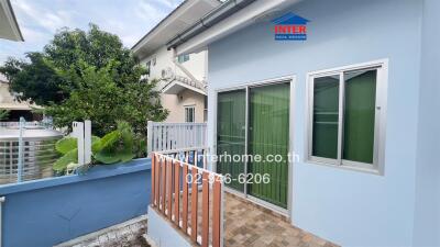 Exterior view of a house with a small balcony