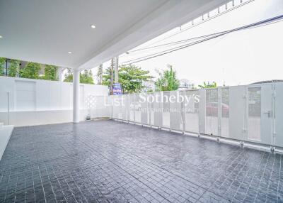 Spacious modern covered garage with tiled flooring