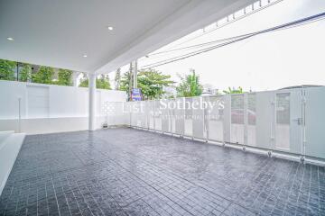 Spacious modern covered garage with tiled flooring