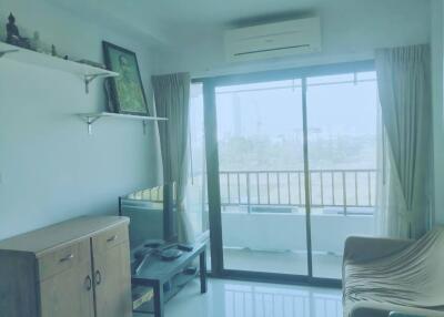 Living room with sliding glass doors to balcony.