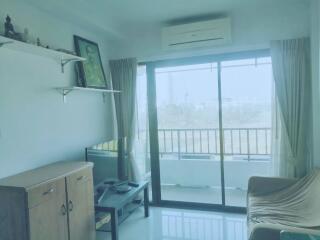 Living room with sliding glass doors to balcony.