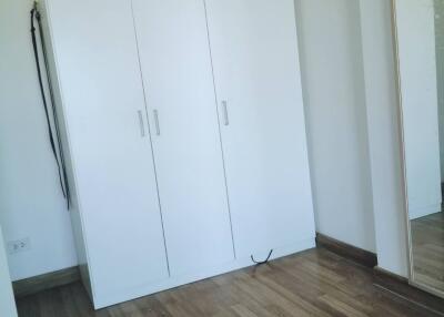 Bedroom with wardrobe and full-length mirror