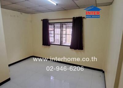 Empty bedroom with window and curtains