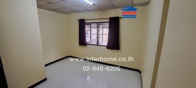 Empty bedroom with window and curtains