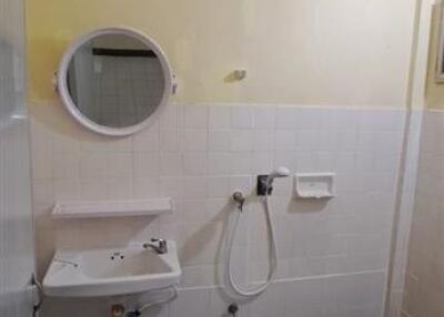 Bathroom with sink, mirror, and shower