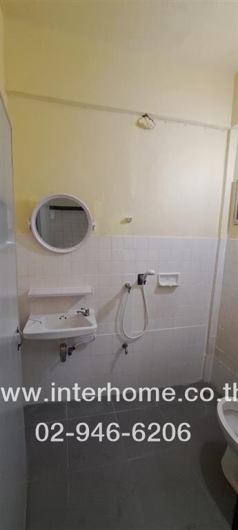 Bathroom with sink, mirror, and shower