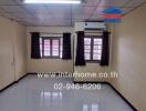 Unfurnished bedroom with tiled flooring and air conditioning