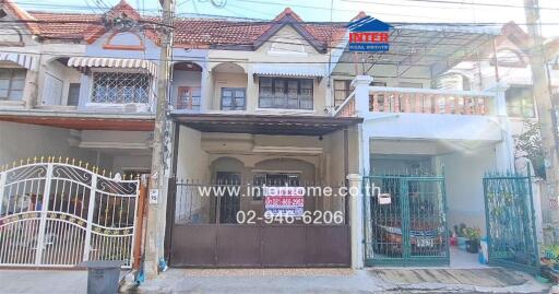 Two-story residential building with a garage