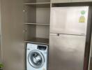 Compact laundry room with washing machine and refrigerator