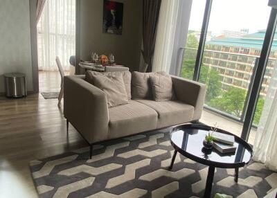 Modern living room with large windows and balcony view