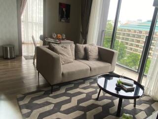 Modern living room with large windows and balcony view