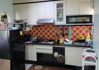 Modern kitchen with appliances and tiled backsplash