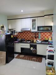 Modern kitchen with appliances and tiled backsplash