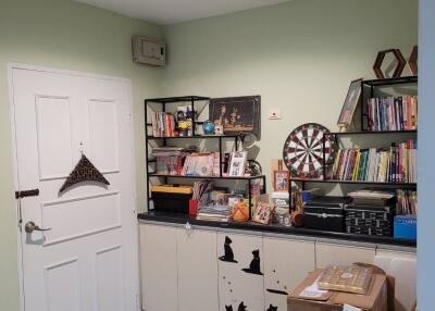 Cozy living room with shelf and decorations