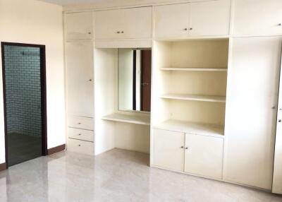 Spacious bedroom with built-in wardrobe and vanity table